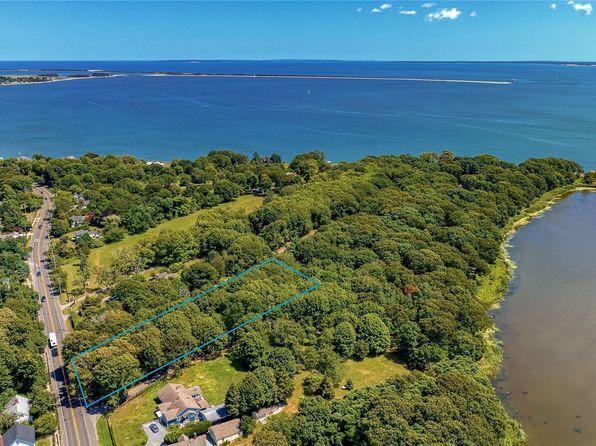 Aerial view of East Marion's wooded peninsula surrounded by pristine waters