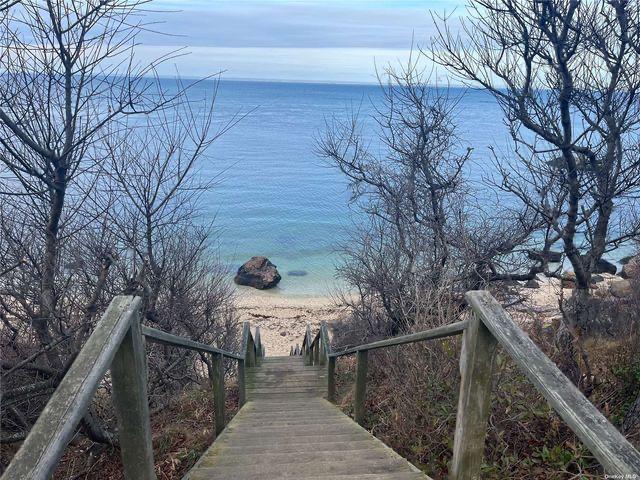 Wooden boardwalk leading to secluded beach
