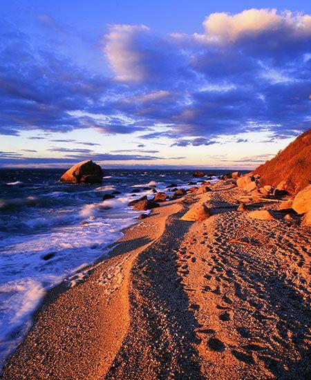 Dramatic sunset over East Marion beach with golden light