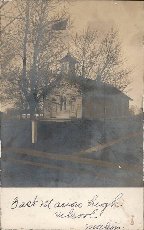 Historic East Marion High School building with bell tower from early 1900s