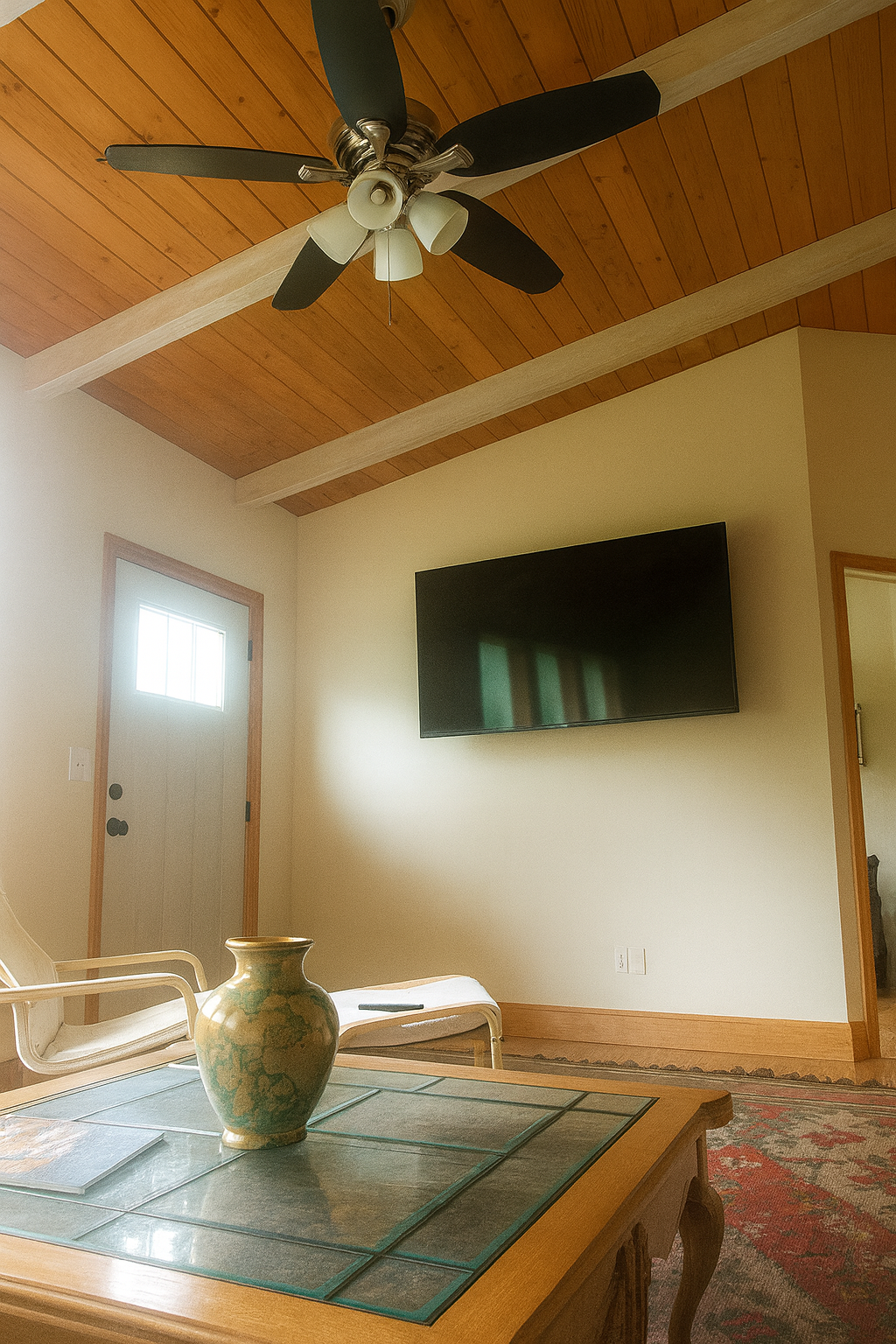 Living room with wood plank ceiling and modern amenities